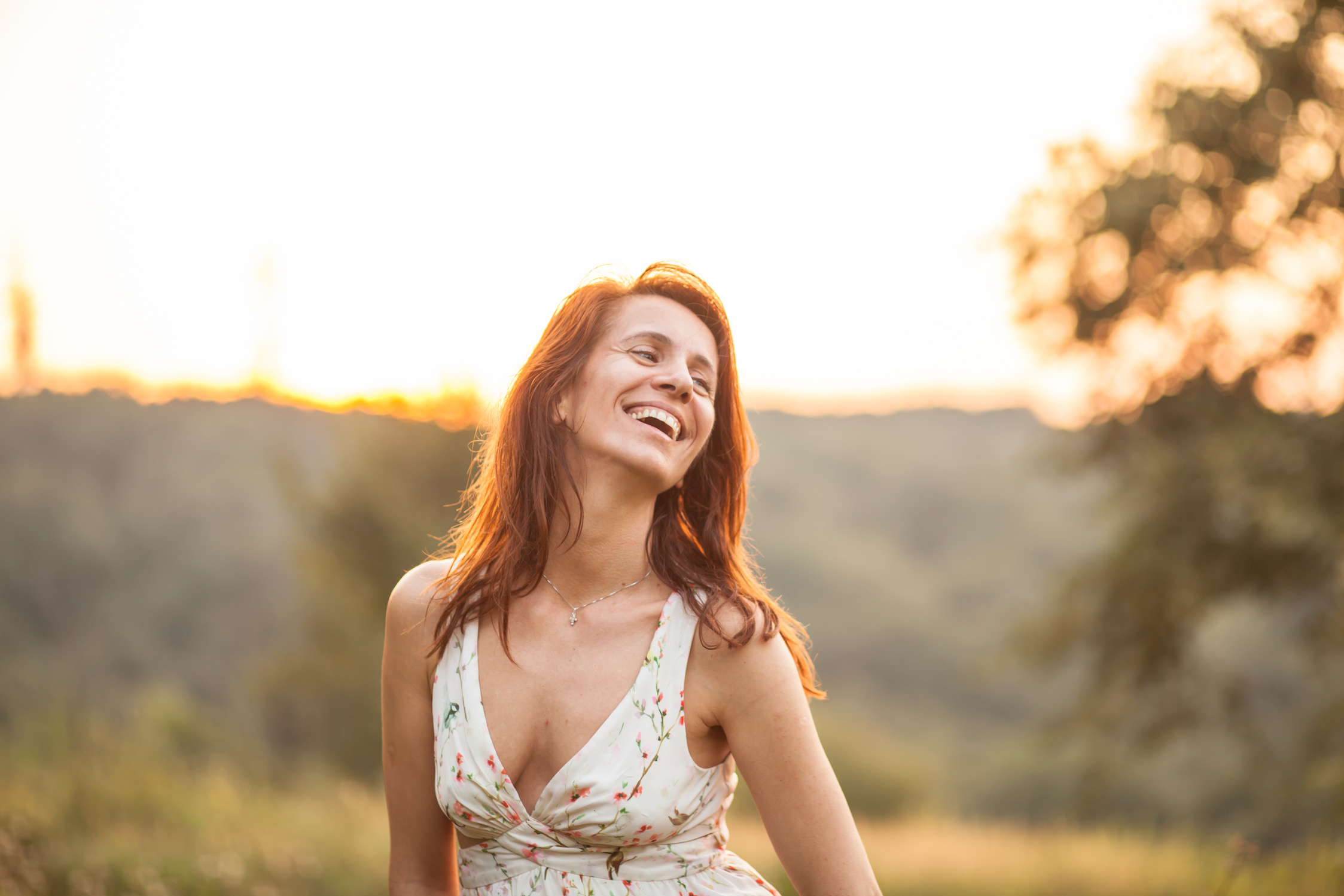 Mature woman enjoying the Sunset