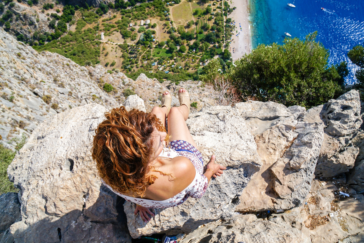 Woman on the edge of cliff.